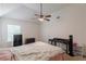 Bedroom featuring a ceiling fan, neutral carpet, and vaulted ceiling at 118 Surge Stone Ln, Stockbridge, GA 30281