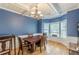 Charming dining room with a decorative light fixture and an alcove at 118 Surge Stone Ln, Stockbridge, GA 30281