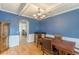 Inviting dining room with wainscoting, chandelier, and hardwood floors at 118 Surge Stone Ln, Stockbridge, GA 30281