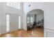 Bright foyer featuring hardwood floors, a tall ceiling, and an arched entryway at 118 Surge Stone Ln, Stockbridge, GA 30281