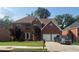 Charming two-story brick home with a well-manicured lawn and attached two-car garage at 118 Surge Stone Ln, Stockbridge, GA 30281