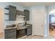 Modern kitchen with stainless steel appliances, stylish cabinetry, and access to the dining area at 118 Surge Stone Ln, Stockbridge, GA 30281