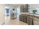 Well-lit kitchen featuring stainless steel appliances, granite countertops, and access to other rooms at 118 Surge Stone Ln, Stockbridge, GA 30281