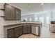 A kitchen featuring stainless steel appliances, granite countertops, and gray cabinetry at 118 Surge Stone Ln, Stockbridge, GA 30281
