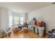 Bright living room with hardwood floors and bay windows at 118 Surge Stone Ln, Stockbridge, GA 30281