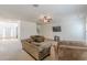 Open-concept living area with neutral carpet, large windows, and a view of the front entryway at 118 Surge Stone Ln, Stockbridge, GA 30281