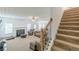 Inviting living room features a cozy fireplace, staircase and comfortable seating for relaxing at 118 Surge Stone Ln, Stockbridge, GA 30281