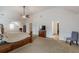Large main bedroom features carpet, bed, vaulted ceilings, and doors to other rooms of the house at 118 Surge Stone Ln, Stockbridge, GA 30281