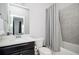 Bright bathroom with a shower-tub combo and a vanity with a white countertop at 2026 Forte Lane, Alpharetta, GA 30009