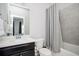 Well-lit bathroom with a tub and shower combination, a vanity with storage, and modern fixtures at 2026 Forte Lane, Alpharetta, GA 30009