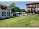 Picturesque outdoor dining area with umbrellas and lush green lawn, ideal for enjoying the community atmosphere at 2026 Forte Lane, Alpharetta, GA 30009