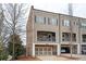 Charming townhome with a two-car garage and a cozy covered balcony perfect for relaxing outdoors at 2026 Forte Lane, Alpharetta, GA 30009