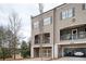 Attractive townhome with a two-car garage and cozy balcony, providing both convenience and outdoor space at 2026 Forte Lane, Alpharetta, GA 30009