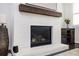 Close-up view of living room fireplace with wooden beam and hearth at 2026 Forte Lane, Alpharetta, GA 30009