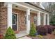 Charming brick home featuring a welcoming front door and manicured landscaping at 2026 Forte Lane, Alpharetta, GA 30009
