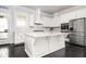 Beautiful kitchen featuring white cabinets, stainless steel appliances, and a large island at 2026 Forte Lane, Alpharetta, GA 30009