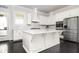 Gourmet kitchen featuring a large island, stainless steel appliances, and custom cabinets at 2026 Forte Lane, Alpharetta, GA 30009