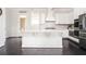 Modern kitchen featuring white cabinetry, stainless steel appliances, and a central island at 2026 Forte Lane, Alpharetta, GA 30009