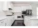 Modern kitchen featuring stainless steel appliances, granite counters and dark hardwood floors at 2026 Forte Lane, Alpharetta, GA 30009