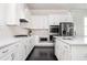 Well-equipped kitchen with modern stainless-steel appliances, white cabinets, and marble countertops at 2026 Forte Lane, Alpharetta, GA 30009