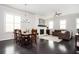 Open-concept living space features a fireplace, dining area, and abundant natural light at 2026 Forte Lane, Alpharetta, GA 30009