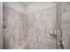 Shower stall with neutral-colored tiles, shower head, and built-in bench seating at 2026 Forte Lane, Alpharetta, GA 30009
