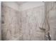 Updated shower stall featuring neutral tile and convenient corner shelf at 2026 Forte Lane, Alpharetta, GA 30009