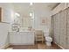 Well-lit bathroom featuring a vanity with storage, a large mirror, and a patterned shower curtain for added style at 515 Saint Barbaras Nw Ln, Marietta, GA 30064