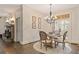 Charming breakfast nook with hardwood floors, chandelier, and natural light, ideal for casual dining at 515 Saint Barbaras Nw Ln, Marietta, GA 30064