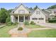 Charming two-story home with a covered front porch, manicured lawn, and two-car garage, perfect for suburban living at 515 Saint Barbaras Nw Ln, Marietta, GA 30064