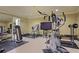 Home gym equipped with exercise machines, weights, and a mirrored wall, promoting a healthy lifestyle at 515 Saint Barbaras Nw Ln, Marietta, GA 30064