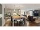Modern kitchen with stainless steel appliances, a kitchen island, and an open layout, seamlessly connecting to the living room at 515 Saint Barbaras Nw Ln, Marietta, GA 30064