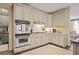 Well-lit kitchen featuring stainless steel appliances and ample counter space, perfect for cooking and entertaining at 515 Saint Barbaras Nw Ln, Marietta, GA 30064