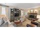 Cozy living room with built-in bookshelves, a stone fireplace, and comfortable seating, creating a relaxing atmosphere at 515 Saint Barbaras Nw Ln, Marietta, GA 30064