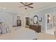 Spacious primary bedroom with neutral tones, plenty of natural light, and adjoining ensuite bathroom access at 515 Saint Barbaras Nw Ln, Marietta, GA 30064