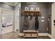 Inviting mudroom featuring a wooden bench, coat rack, and artwork, with easy access to the home's interior at 515 Saint Barbaras Nw Ln, Marietta, GA 30064