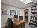 Home office with a large desk, bookshelves, and neutral decor, creating a functional workspace at 515 Saint Barbaras Nw Ln, Marietta, GA 30064