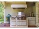 Outdoor kitchen featuring a stainless steel grill, prep area, and cabinets, ideal for barbecues at 515 Saint Barbaras Nw Ln, Marietta, GA 30064