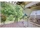 Outdoor kitchen on a wooden deck, equipped with a grill, offering a perfect space for outdoor cooking at 515 Saint Barbaras Nw Ln, Marietta, GA 30064
