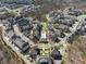 Stunning aerial view of a community showcasing manicured lawns, a sparkling pool, and well-maintained residences at 6838 Prelude Dr, Atlanta, GA 30328