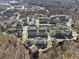 An aerial view of townhome community surrounded by lush trees at 6838 Prelude Dr, Atlanta, GA 30328