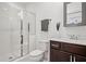 Bathroom features a dark wood vanity, walk-in shower, and white tiling at 6838 Prelude Dr, Atlanta, GA 30328