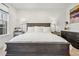 Bedroom features dark wood furniture, a bright window, and white linens at 6838 Prelude Dr, Atlanta, GA 30328