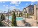Community pool surrounded by townhomes, lounge chairs, and tables at 6838 Prelude Dr, Atlanta, GA 30328