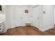 Bright hallway with hardwood flooring, white doors, and elegant decor at 6838 Prelude Dr, Atlanta, GA 30328