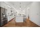 Modern kitchen with white cabinets, stainless steel appliances, a center island, and hardwood floors at 6838 Prelude Dr, Atlanta, GA 30328