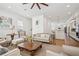 Open-concept living area flows into kitchen, features hardwood floors and stylish decor at 6838 Prelude Dr, Atlanta, GA 30328