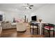 Open-concept living room with hardwood floors, ceiling fan, and bright natural light at 6838 Prelude Dr, Atlanta, GA 30328