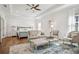 Spacious main bedroom features a ceiling fan, sitting area, and light-filled windows at 6838 Prelude Dr, Atlanta, GA 30328