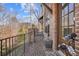 Brick patio with black railing features an exterior door and flower pots at 6838 Prelude Dr, Atlanta, GA 30328